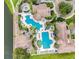 Aerial view of clubhouse with community pools, sun decks, and palm trees providing residents with outdoor activities at 3707 Paradiso Cir, Kissimmee, FL 34746
