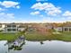Aerial view of lakefront homes and docks with lush green lawns, perfect for boating and water activities at 3707 Paradiso Cir, Kissimmee, FL 34746