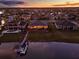 Beautiful aerial view of waterfront homes with docks in a lakeside community at 3707 Paradiso Cir, Kissimmee, FL 34746