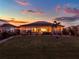 Relaxing screened-in patio with a tropical setting and gorgeous sunset at 3707 Paradiso Cir, Kissimmee, FL 34746