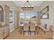 Bright dining room featuring large windows with lake views and stylish furnishings at 3707 Paradiso Cir, Kissimmee, FL 34746