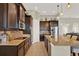 Spacious kitchen featuring stainless appliances, granite counters, and ample cabinet space at 3707 Paradiso Cir, Kissimmee, FL 34746