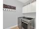 Clean and modern laundry room with new appliances and decorative decor at 3707 Paradiso Cir, Kissimmee, FL 34746