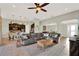 Open concept living room with tile floors and views into the kitchen and dining area at 3707 Paradiso Cir, Kissimmee, FL 34746