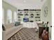 Bright office space with custom built-ins, a comfortable sofa, and natural light at 3707 Paradiso Cir, Kissimmee, FL 34746