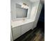 Bright bathroom featuring a quartz countertop vanity and modern gold fixtures at 4100 Player Cir # 101, Orlando, FL 32808