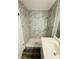 Modern bathroom with tiled shower and quartz countertop vanity at 4100 Player Cir # 101, Orlando, FL 32808