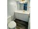 Bathroom features a vanity with white cabinets, modern countertops and gold fixtures at 4100 Player Cir # 101, Orlando, FL 32808