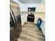 Modern kitchen featuring stainless steel appliances, white cabinets, and sleek countertops at 4100 Player Cir # 101, Orlando, FL 32808