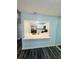 Modern kitchen pass-through with bright white countertops, stainless steel appliances, and sleek white cabinets at 4100 Player Cir # 101, Orlando, FL 32808