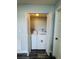 Laundry room with white washer and dryer behind white shutter doors at 4100 Player Cir # 101, Orlando, FL 32808