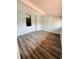 Spacious living room with beam and laminated flooring, offering a modern aesthetic at 4100 Player Cir # 101, Orlando, FL 32808