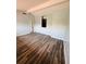 Living room featuring laminated floors, neutral paint, and a modern aesthetic at 4100 Player Cir # 101, Orlando, FL 32808