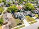 Overhead shot of the property highlighting its landscaping, surrounding trees, and proximity to neighboring homes at 4321 Iveyglen Ave, Orlando, FL 32826