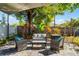 Charming backyard patio seating area with lush tropical plants and privacy fence at 4321 Iveyglen Ave, Orlando, FL 32826