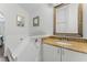 Bathroom featuring granite countertop, white cabinets, and subway tile at 4321 Iveyglen Ave, Orlando, FL 32826