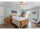 Inviting bedroom with hardwood floors, soft bedding, and natural light, creating a peaceful retreat at 4321 Iveyglen Ave, Orlando, FL 32826