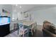 Dining area featuring stylish decor, modern flooring, and seamless flow to the living spaces at 4321 Iveyglen Ave, Orlando, FL 32826