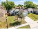 Charming single-Gathering home featuring a well-kept lawn, mature tree, and a welcoming driveway at 4321 Iveyglen Ave, Orlando, FL 32826