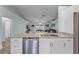 Kitchen featuring granite countertops, stainless steel dishwasher, and modern cabinetry at 4321 Iveyglen Ave, Orlando, FL 32826