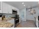 Well-equipped kitchen with stainless steel appliances, modern cabinetry, and granite countertops at 4321 Iveyglen Ave, Orlando, FL 32826