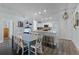 Open kitchen and dining area with granite countertops, a breakfast bar, and modern appliances at 4321 Iveyglen Ave, Orlando, FL 32826
