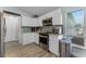 Well-lit kitchen featuring stainless steel appliances and white cabinetry with stylish countertops at 4321 Iveyglen Ave, Orlando, FL 32826