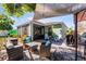 Inviting outdoor patio with comfortable seating, shade awning, and a built-in grill perfect for entertaining at 4321 Iveyglen Ave, Orlando, FL 32826