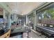 Bright sunroom with hardwood floors, a desk, and large windows overlooking the back yard at 4321 Iveyglen Ave, Orlando, FL 32826
