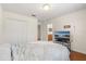 Bedroom with a bed and wood floors and an adjoining bath at 4822 Lake Milly Dr, Orlando, FL 32839