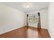 Empty bedroom with hardwood floors, curtains, a window, and neutral walls at 4822 Lake Milly Dr, Orlando, FL 32839