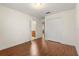 Spacious bedroom featuring hardwood floors, en-suite bathroom, and walk-in closet at 4822 Lake Milly Dr, Orlando, FL 32839
