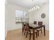 Bright dining room with tile floors, modern lighting, and window views at 4822 Lake Milly Dr, Orlando, FL 32839