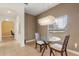 The dining room features a modern chandelier and large window, providing natural light and a view of the outside at 4822 Lake Milly Dr, Orlando, FL 32839
