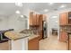 Modern kitchen featuring a breakfast bar with granite countertops and stainless appliances at 4822 Lake Milly Dr, Orlando, FL 32839