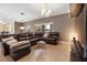 Comfortable living room featuring a leather sectional sofa and modern décor at 4822 Lake Milly Dr, Orlando, FL 32839