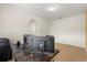A bright office space featuring a large desk, multiple monitors and an arched doorway at 4822 Lake Milly Dr, Orlando, FL 32839