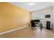 Bright office space with a large window and modern desk setup with wall calendar and printer at 4822 Lake Milly Dr, Orlando, FL 32839