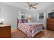 Bedroom with hardwood floors and natural light from the windows at 4991 Tangerine Ave, Winter Park, FL 32792