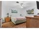 Cozy bedroom featuring a ceiling fan, and natural light from large windows at 4991 Tangerine Ave, Winter Park, FL 32792