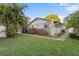 A charming single-story home with lush greenery, beautiful landscaping, and a well-manicured lawn at 4991 Tangerine Ave, Winter Park, FL 32792