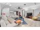 Spacious living room featuring neutral tones, tile flooring, comfortable seating, and modern lighting fixtures at 4991 Tangerine Ave, Winter Park, FL 32792