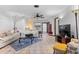 Bright living room with tile floors, a ceiling fan, comfortable seating, and a sliding door to the backyard at 4991 Tangerine Ave, Winter Park, FL 32792