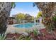 Relax in this private pool surrounded by landscaped garden and tropical plants, perfect for sunny days at 4991 Tangerine Ave, Winter Park, FL 32792