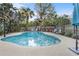 Private backyard pool with shaded seating area at 4991 Tangerine Ave, Winter Park, FL 32792
