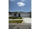 Charming single-story home with a well-manicured lawn and an attached two-car garage at 511 Coronado Cove Rd, New Smyrna Beach, FL 32168
