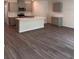 Spacious kitchen with a large center island, stainless steel appliances, and wood flooring at 511 Coronado Cove Rd, New Smyrna Beach, FL 32168