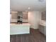 Modern kitchen featuring stainless steel appliances, a large island, and stylish cabinetry at 511 Coronado Cove Rd, New Smyrna Beach, FL 32168