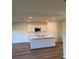 Modern kitchen with sleek countertops, stainless steel appliances, and a spacious island at 512 Coronado Cove Rd, New Smyrna Beach, FL 32168
