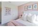 Cozy bedroom features comfortable bedding, stylish wall decor, and soothing color palette at 514 Coronado Cove Rd, New Smyrna Beach, FL 32168